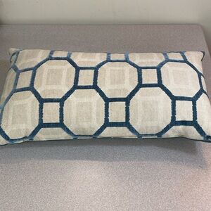 Teal geometric lumbar decorator pillow.